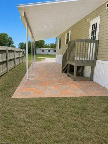 Outdoor patio featuring flagstone-style pavers with a solid perimeter