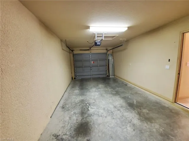 Garage featuring a garage door opener