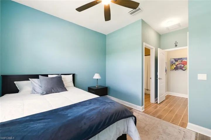 Bedroom featuring wood finish floors and a ceiling fan