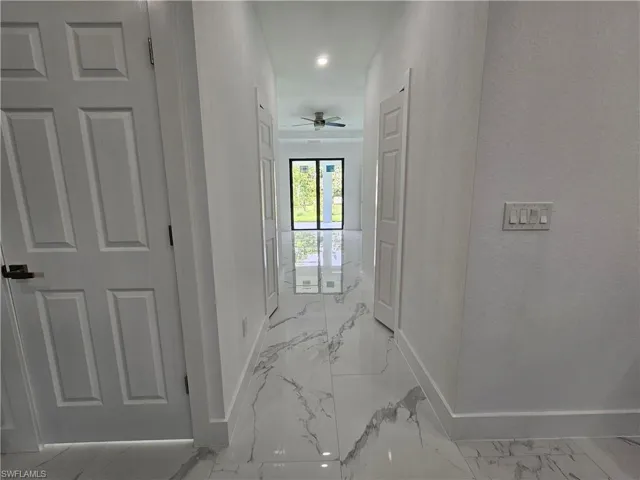 Hall with tile patterned floors