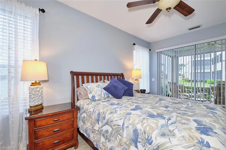 Bedroom with access to outside and ceiling fan