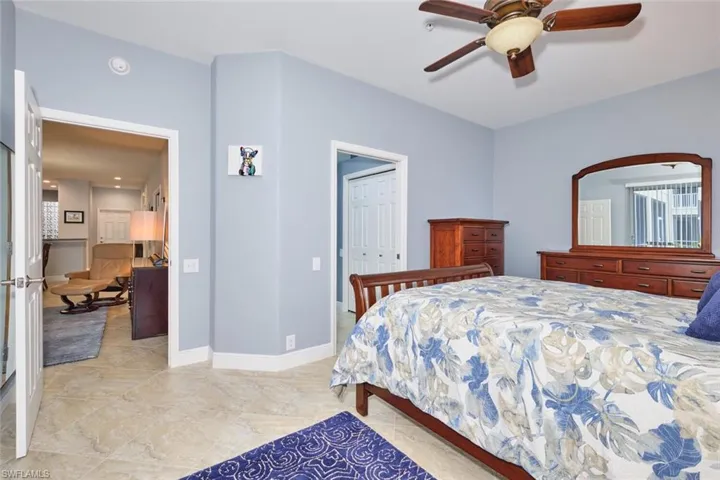 Bedroom with a closet and ceiling fan