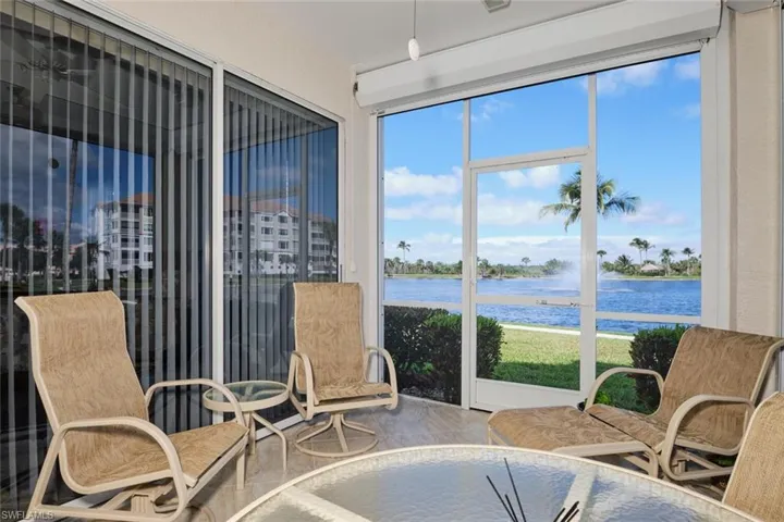Sunroom / solarium with a water view