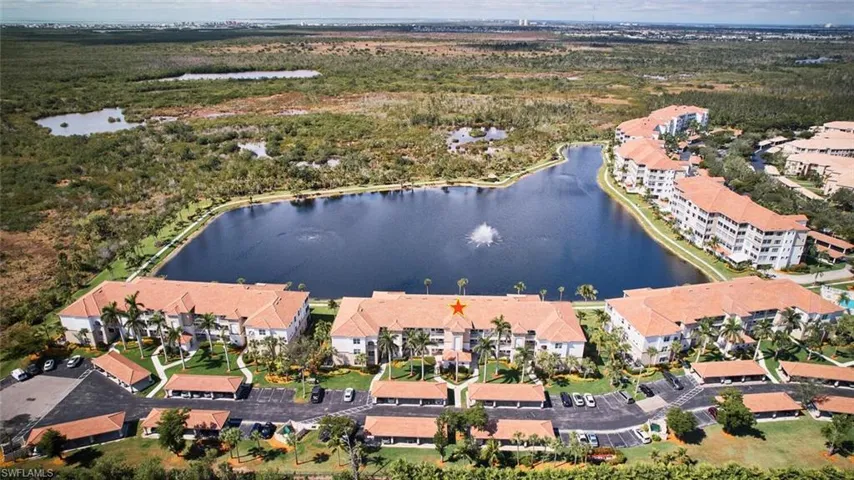 Aerial overview of property's location with a large body of water