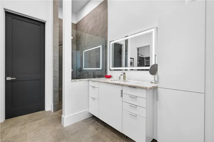Bathroom with walk in shower and vanity