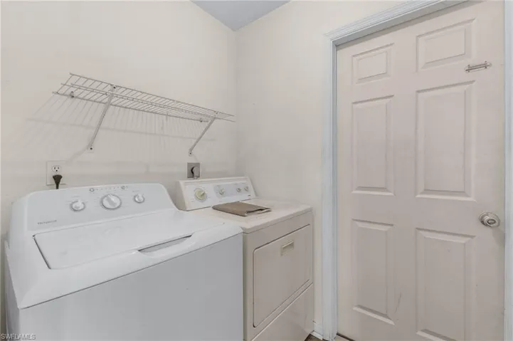 Laundry area featuring separate washer and dryer