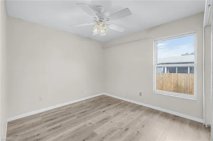 Spare room with ceiling fan and light hardwood / wood-style floors