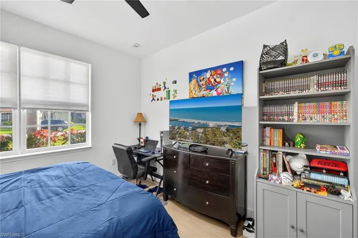 Bedroom featuring light wood-style floors and ceiling fan