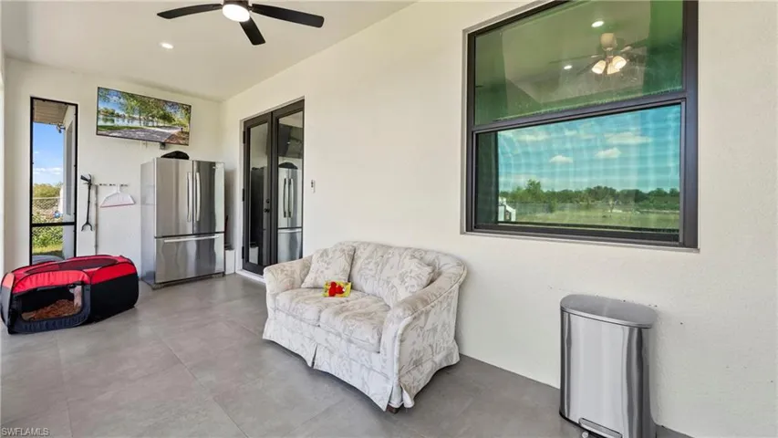 View of patio featuring ceiling fan