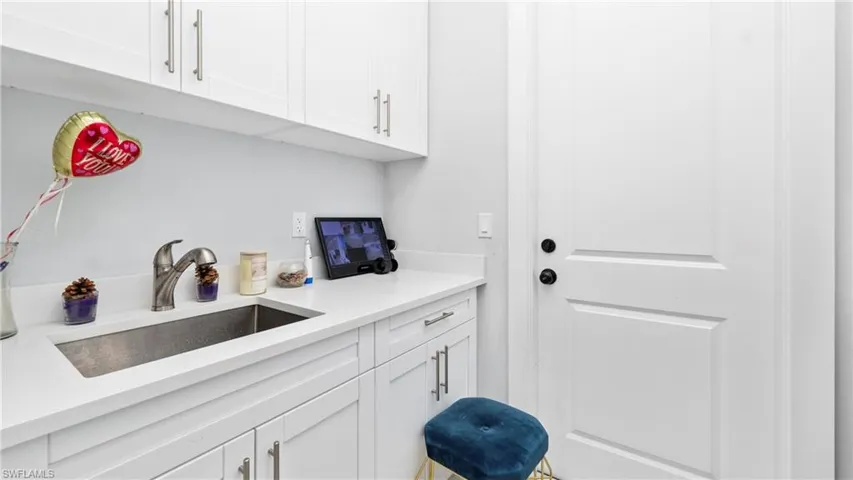 Laundry room with a sink