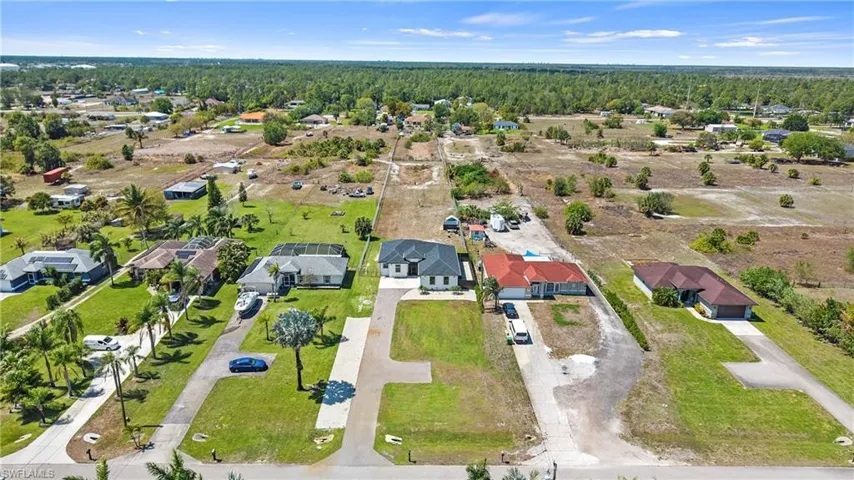 Aerial view of residential area with a forest