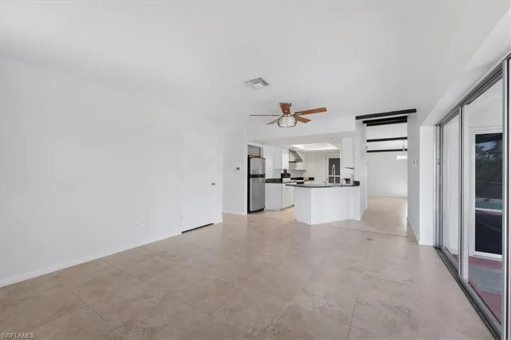 family room featuring SGD to lanai and a ceiling fan