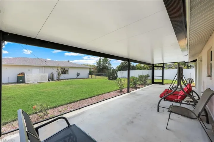 View of patio / terrace with a fenced backyard and a carport