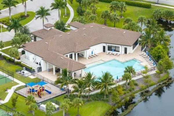 Aerial view of property and surrounding area with a pool