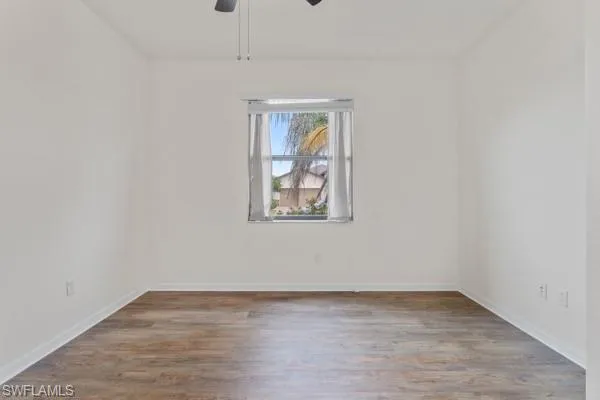 Empty room featuring light wood-style floors and ceiling fan