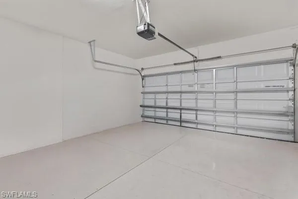 Garage featuring a garage door opener