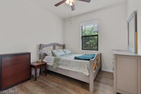 Bedroom featuring wood finished floors and ceiling fan