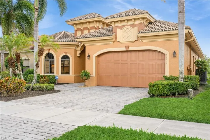 Mediterranean / spanish house featuring a garage