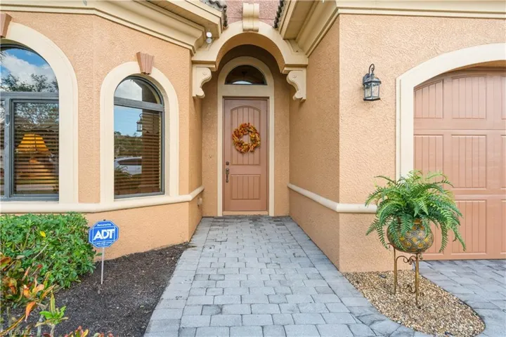 View of exterior entry featuring a garage