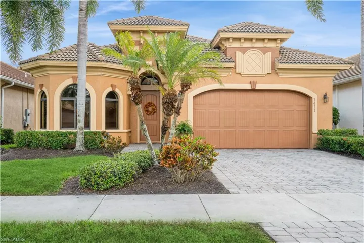 Mediterranean / spanish home featuring a garage