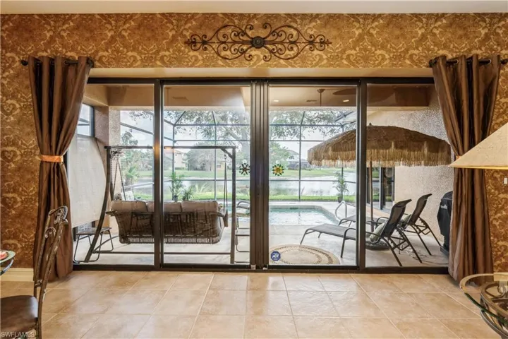 Doorway featuring tile patterned floors and a healthy amount of sunlight