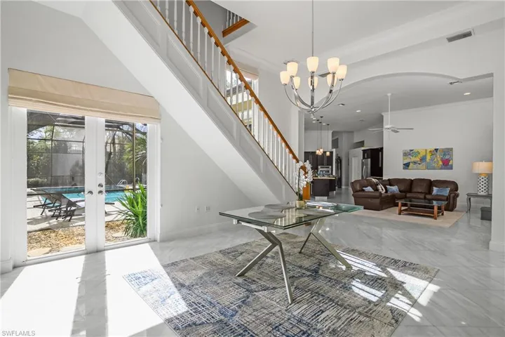 Dining room to upstairs loft, living room and kitchen