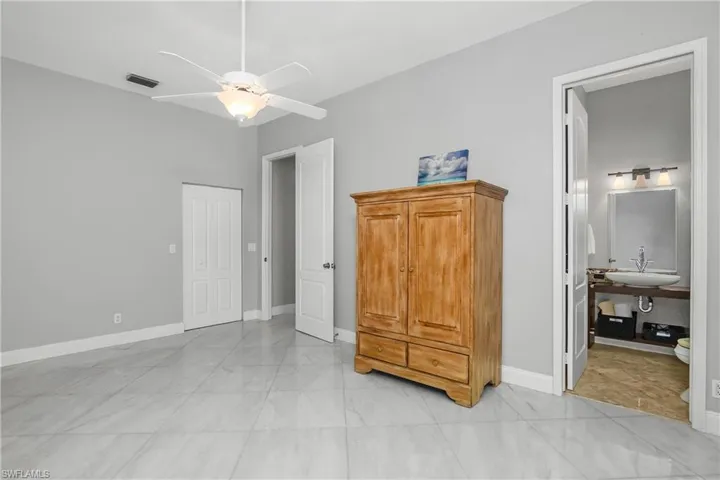 Third Bedroom with a ceiling fan and ensuite bathroom