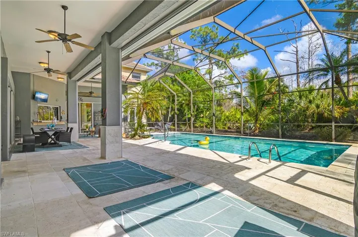 Swimming pool with private preserve view and huge under cover lanai space