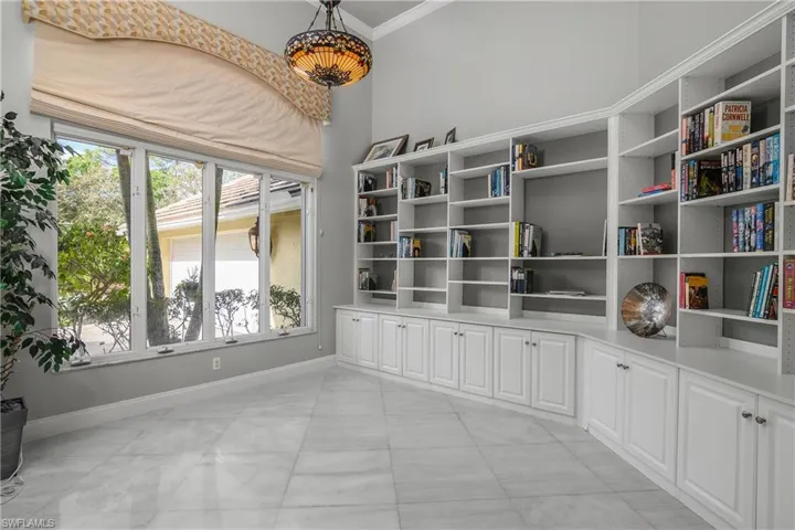 Library with baseboards and crown molding