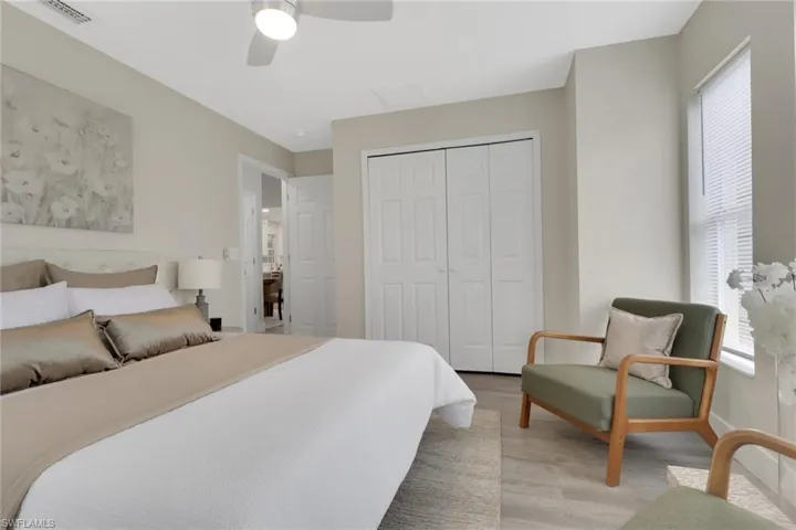 Room featuring soft neutral wall tones and wood-finish flooring