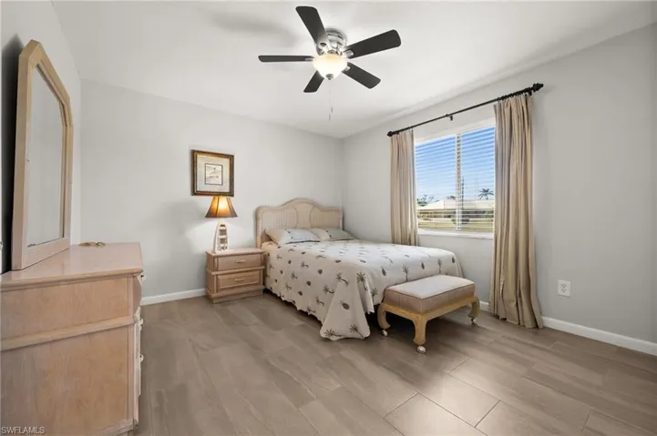 Bedroom featuring ceiling fan and light hardwood / wood-style floors