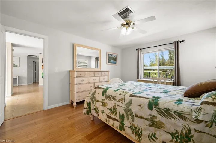 Bedroom featuring ceiling fan and light hardwood / wood-style floors