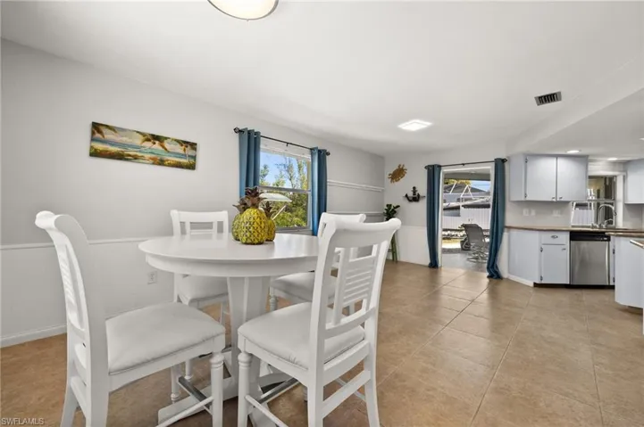 Tiled dining area with sink