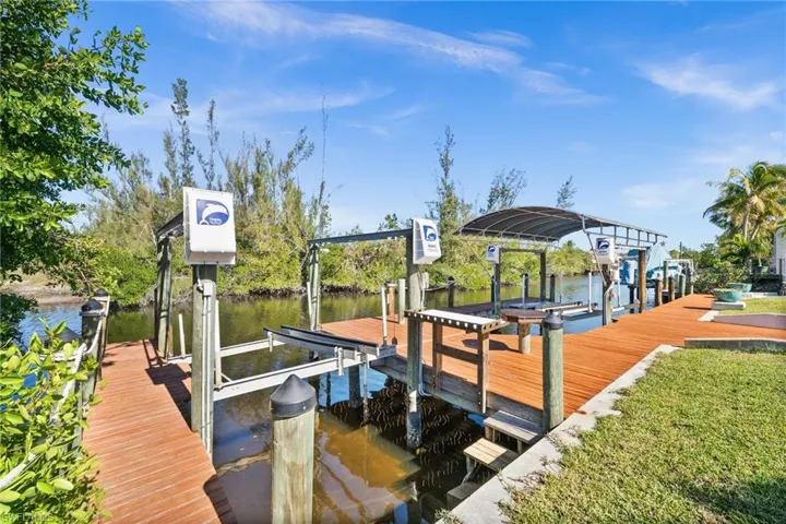 Dock area featuring a water view