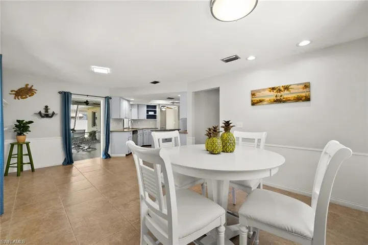 Tiled dining area with sink