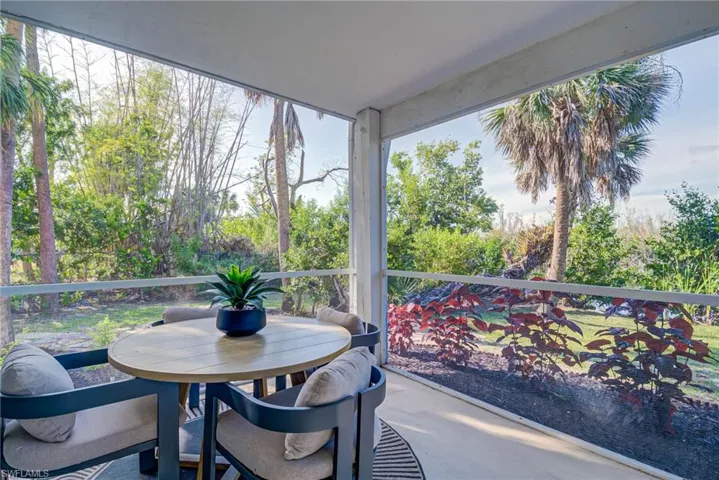 Lower level room opens to this area which is screened-in and has views of the water and leads to the pool