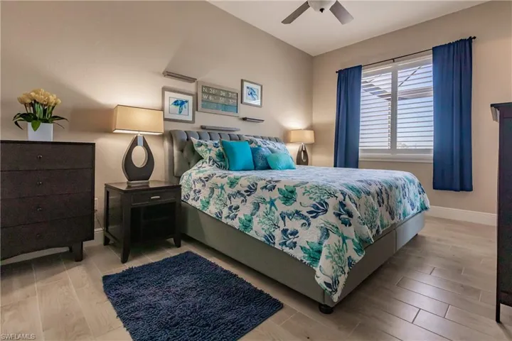 Ensuite Bedroom featuring ceiling fan & bath with shower, also used as Pool Bath