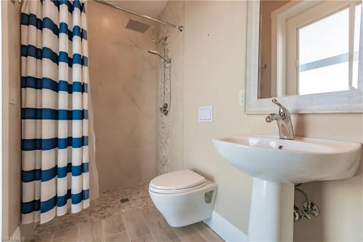 Junior Suite and Pool bath featuring a shower