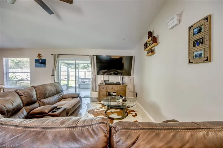 Tiled living room with ceiling fan
