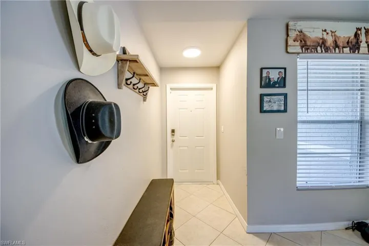 Entryway with light tile patterned floors