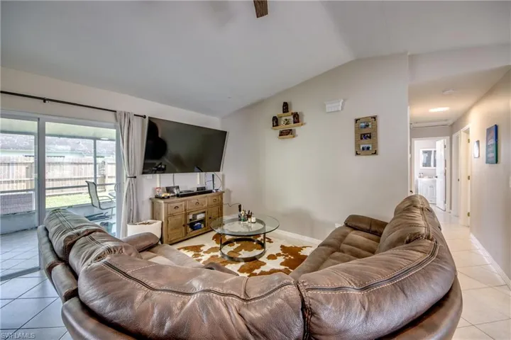 Tiled living room with vaulted ceiling