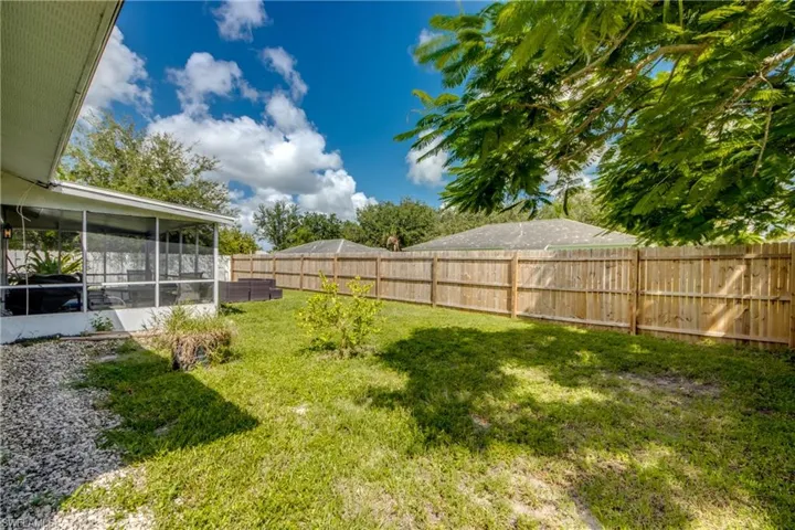 View of yard featuring a sunroom