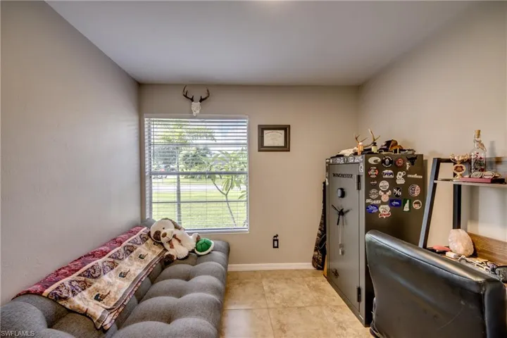 Living room with light tile patterned floors