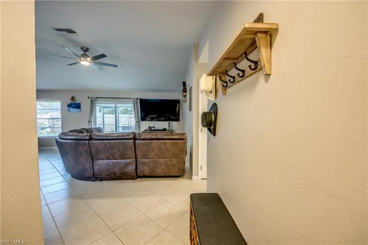 Tiled living room with ceiling fan