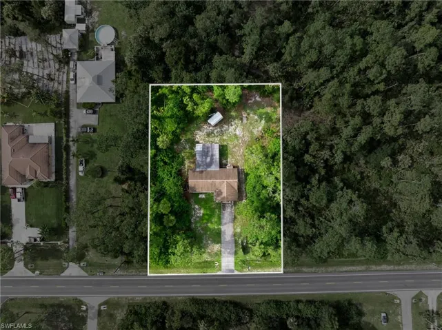 Aerial overview of property's location featuring property parcel outlined