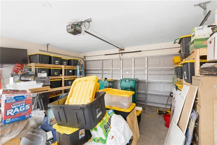 Garage featuring a garage door opener