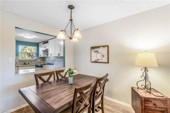 Dining space featuring a chandelier and light wood-style flooring