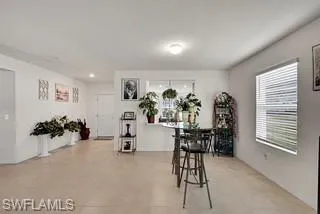 Dining room with light tile patterned floors