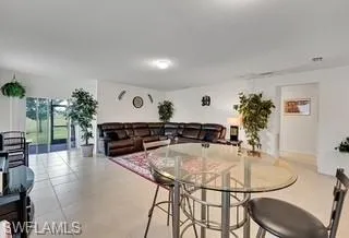 Dining room with light tile patterned flooring