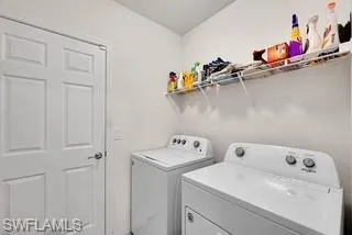 Washroom with washing machine and dryer